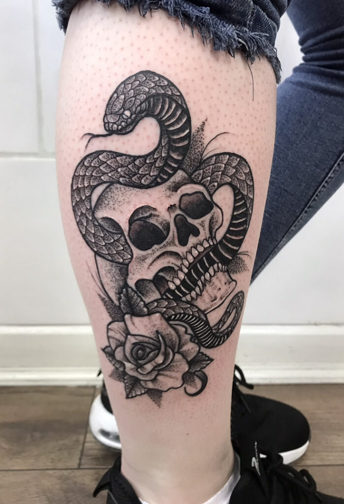 snake, skull and rose tattoo in a traditional style