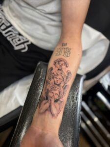 black and grey realism tattoo